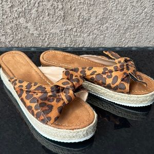 Size 9 never worn wedge sandals in animal print!